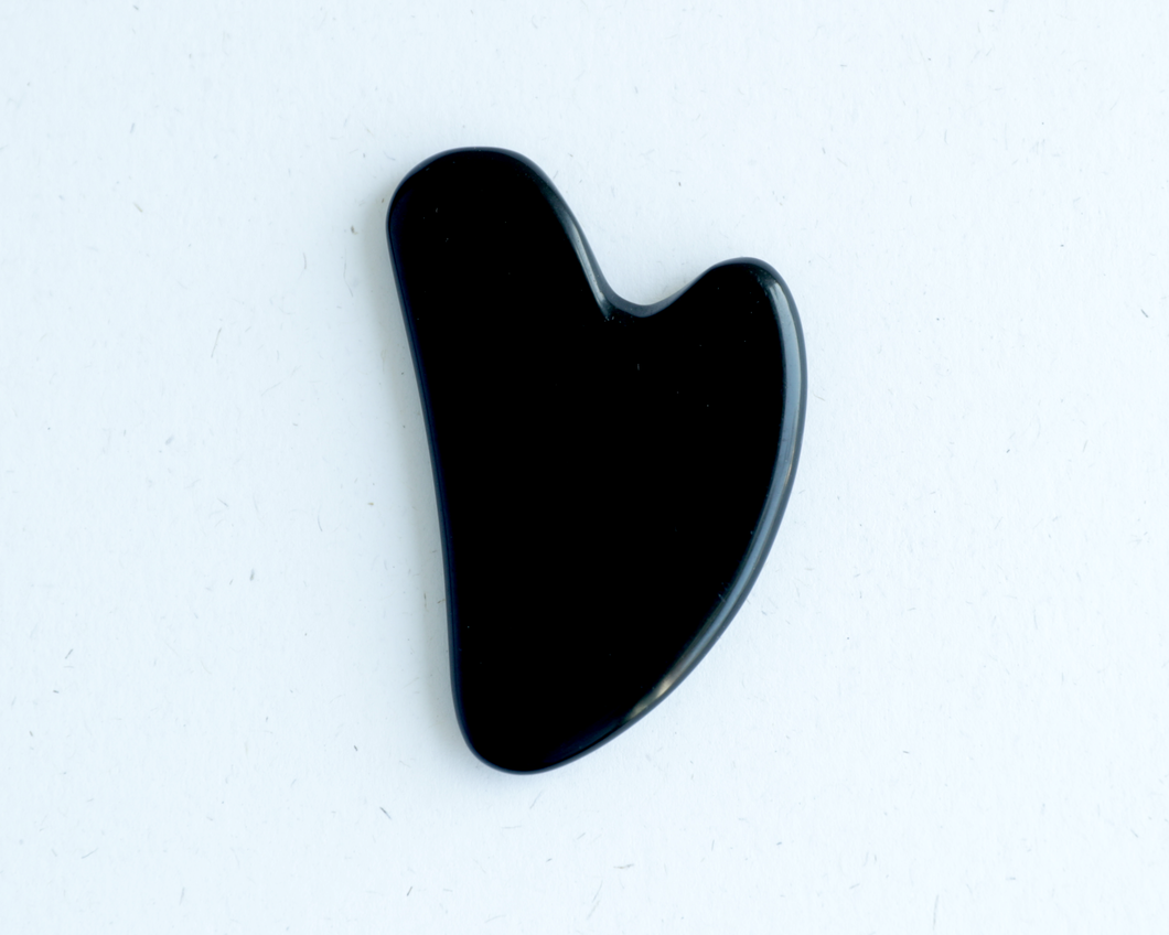 - Obsidian Gua Sha Tool